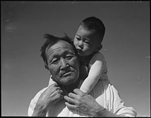 Manzanar Relocation Center, Manzanar, California. Grandfather and grandson of Japanese ancestry at . . . - NARA - 537994