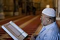 Palestinian Muslim reading The Holy Qur'an in Al-Aqsa mosque