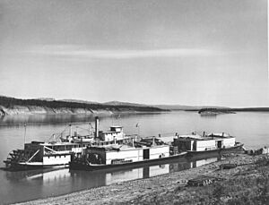 Sternwheeler Mackenzie River and 3 barges at Fort Wrigley in 1946