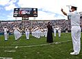 US Navy 051113-N-1126D-004 Navy Band Southeast performs the National Anthem as U.S. Army Staff Sgt. Erica Russo sings the anthem at the Jacksonville Jaguars pre-game ceremony