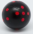 Black and red round 6-sided die (cropped)