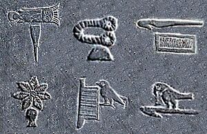 Early hieroglyphic symbols on the Narmer plate