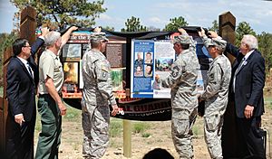 From left to right- South Dakota Lt. Gov. Matt Michels, Craig Bobzien, Black Hills National Forest supervisor, U.S. Army Maj. Gen. Gregory Lusk, adjutant general of the North Carolina(N 130701-Z-RN486-005