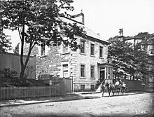 Black and white photograph from 1879 of Henry House with carriage in front