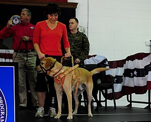 Prisoner-trained service dog is placed with a wounded service member 111201-F-WA575-299
