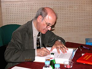 Quino (cartoonist) autographs a book in Paris, 2004