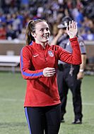 U.S. player Rose Lavelle waving to a member of the audience