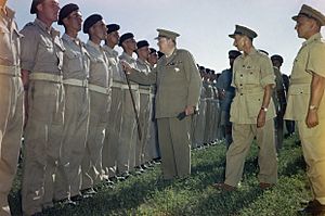 Winston Churchill inspecting men of the 4th Queen's Own Hussars at Loreto aerodrome, Italy, 25 August 1944. TR2275