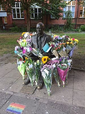 Alan Turing's statue surrounded by flowers on his birthday 2018