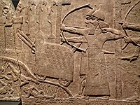 Assyrian relief of attack on an enemy town during the reign of Tiglath-Pileser III 720-743 BCE from his palace at Kalhu (Nimrud)