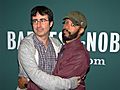 John Oliver Wyatt Cenac hug Shankbone
