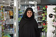Nasra Agil, owner of Mogadishu's first dollar store, stands among her products in the Somali capital on January 20. AU UN IST PHOTO - Tobin Jones (12084954593)