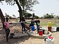 Women and children at a borehole