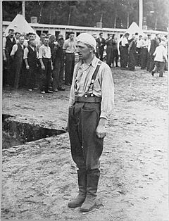 A Polish POW stands at attention in the Appellplatz at the Stutthof concentration camp
