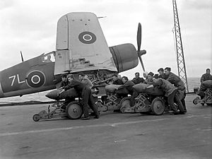 British naval personnel moving bombs before a raid during Operation Goodwood