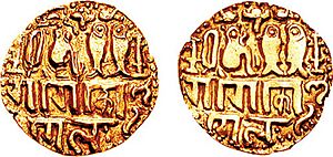 Gold Gadyana coin of emperor Rajaraja I (985–1014). Uncertain Tamil Nadu mint. Legend "Chola, conqueror of the Gangas" in Tamil, seated tiger with two fish. of Chola empire