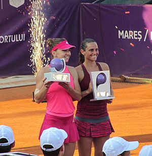 Halep and Vinci with trophies at 2014 Bucharest Open (cropped)