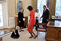 Michelle Obama curtsies with Lynne Silosky