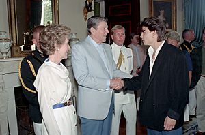 President Ronald Reagan greets Johnny Depp while Nancy Reagan looks on