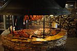 Texas-style barbecue smoke pit with various meats