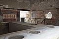 Thermopolium of Vetutius Placidus opening directly onto the south side of the Via dell'Abbondanza, Pompeii (15042641332)