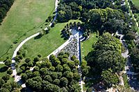 Aerial view of the triangular memorial surrounded by trees