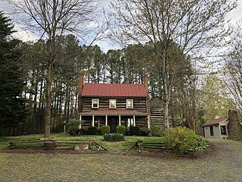 This is a picture of The Beadles House, a historic log cabin listed on the National Register of Historic Places.
