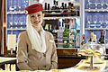 Emirates flight attendant in the Airbus A380 bar