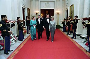 President Ronald Reagan and Nancy Reagan with Bill Clinton and Hillary Clinton walking in the Cross Hall