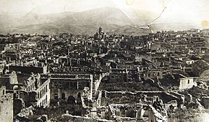 Armenian boroughs of city of Shusha destroyed by Azerbaijani armed forces in 1920 with defiled cathedral of Holy Savior on background