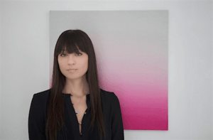 Artist Miya Ando with painting behind2.png