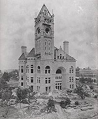 Courthouse building under construction with clock–tower but no clock