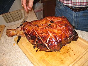 A baked country ham ready for serving