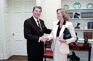 President Ronald Reagan greeting actress Cybill Shepherd in the Oval Office