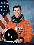 Richard Husband, NASA photo portrait in orange suit