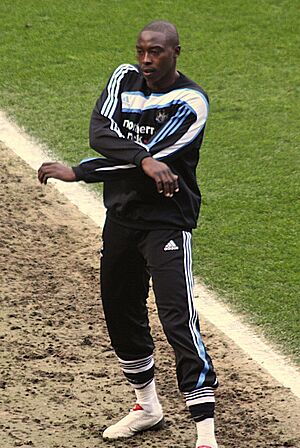 Shola Ameobi warming up