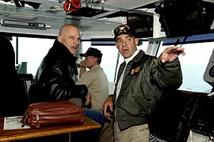 US Navy 040618-N-6817C-090 Director Rob Cohen visits with Commanding Officer, USS Abraham Lincoln (CVN 72), Capt. Kendall L. Card, on the bridge after the completion of filming, the upcoming motion picture Stealth.jpg
