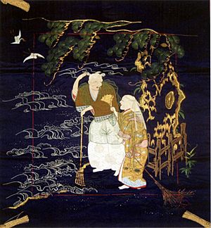 19th century Fukusa portraying the legend of Takasago with Jo and Uba under a pine tree, embroidered silk and couched gold-wrapped thread on indigo dyed shusa satin silk