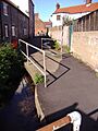 Beeston Beck running at the back of houses in Beeston Road, Sheringham