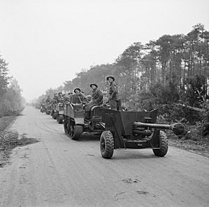 Carriers and 6-pdr anti-tank guns of the 2nd Gordon Highlanders, 15th (Scottish) Division, during the assault on Tilburg, Holland, 28 October 1944. B11420