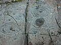 Cup and Ring markings on inscribed stone