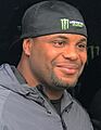 Daniel Cormier taking a picture with a fan.