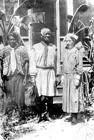 Deaconess Bedell with medicine man and Bobby Jim Tiger outside the mission.jpg
