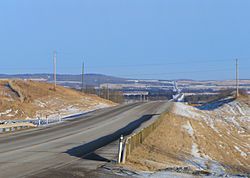 Highway 11 passing through ranch land and aspen parkland in Red Deer County