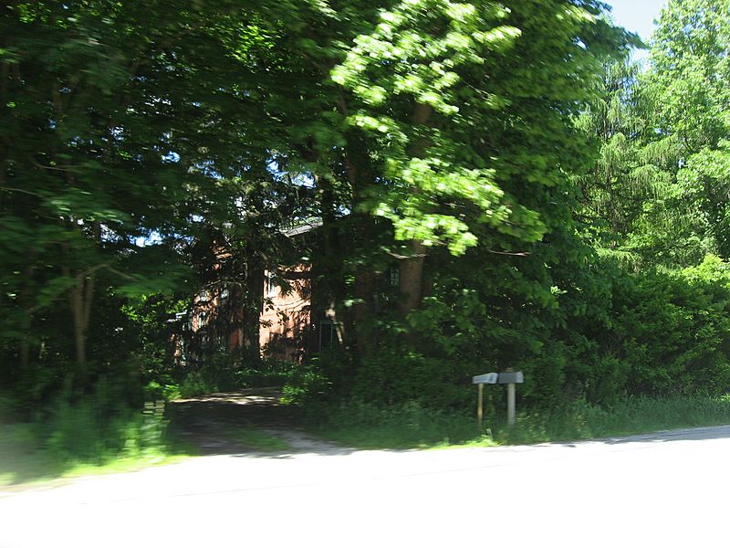 Pinehurst Hall through trees