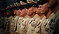 US Navy 080916-N-9769P-144 Newly pinned chiefs stand at attention during Naval Station Guantanamo Bay's Chief Pinning Ceremony