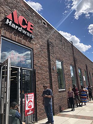 Customers waiting outside ACE Hardware in Baltimore