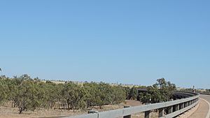 Driving across the Georgina River Bridge from Camooweal looking south at the dry river bed, 2019 03