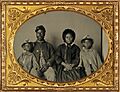 African American soldier in Union uniform with wife and two daughters (cropped)
