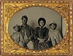 African American soldier in Union uniform with wife and two daughters (cropped)